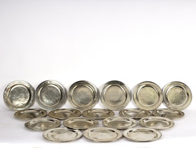 Lot 435 - Eighteen polished pewter plates, 28cm diameter