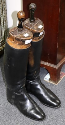 Lot 472 - A pair of black leather riding boots with trees