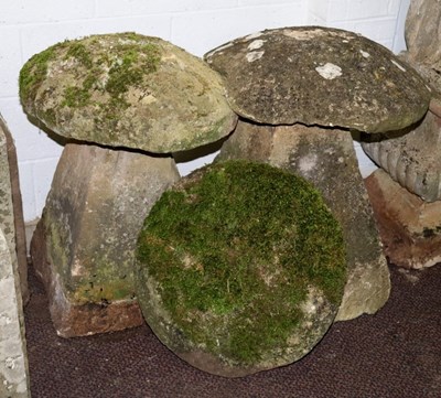 Lot 500 - Two staddle stones with bases and a spare tops