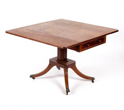 Lot 517 - A Regency mahogany two-flap breakfast table...