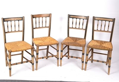 Lot 523 - Four spindle back chairs with rush seats,...