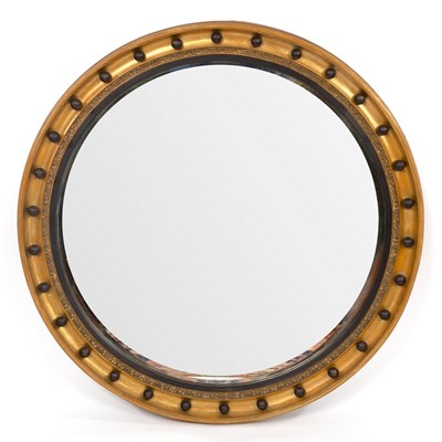 Lot 532 - A Regency circular mirror, the concave ball...