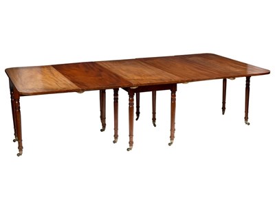 Lot 554 - A George IV mahogany dining table with rounded...