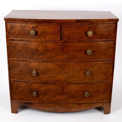 Lot 557 - An early 19th Century mahogany bowfront chest...