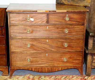 Lot 563 - An early 19th Century mahogany chest of three...