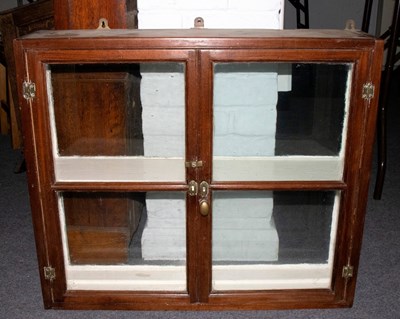 Lot 582 - A small double sided display case enclosed by...