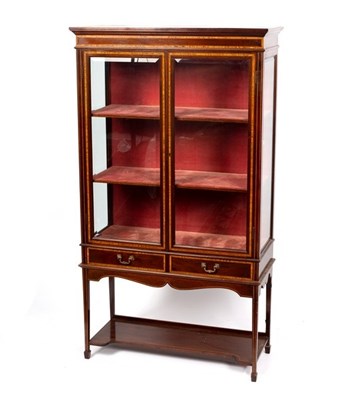 Lot 589 - An Edwardian mahogany display cabinet banded...