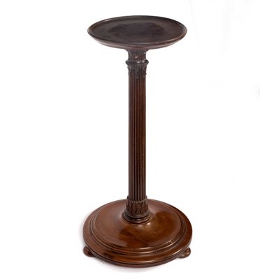 Lot 592 - A mahogany jardinière stand with reeded column...