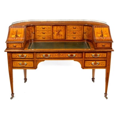 Lot 600 - A satinwood inlaid Carlton House desk, the...