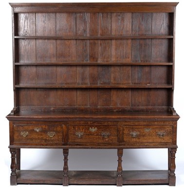 Lot 603 - An oak dresser with shelves over, fitted three...