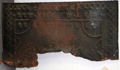 Lot 634 - A cast iron fire back, 58cm x 120cm