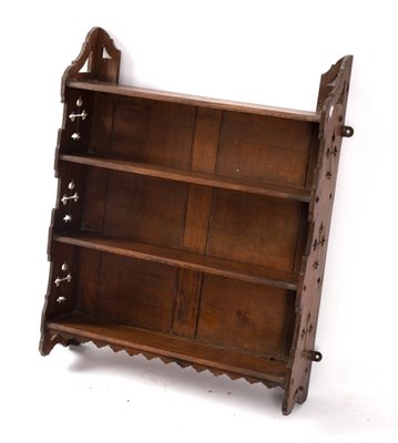 Lot 638 - A set of hanging shelves with pierced ends,...