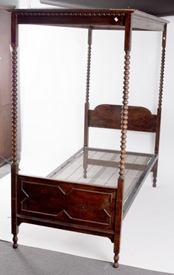 Lot 641 - A child's four poster bed with bobbin-turned...