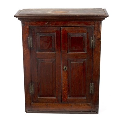 Lot 649 - An 18th Century oak cupboard, enclosed by twin...