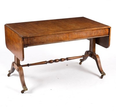 Lot 673 - A Regency style yew wood sofa table, the...