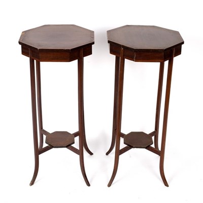 Lot 676 - A pair of Edwardian octagonal topped stands...