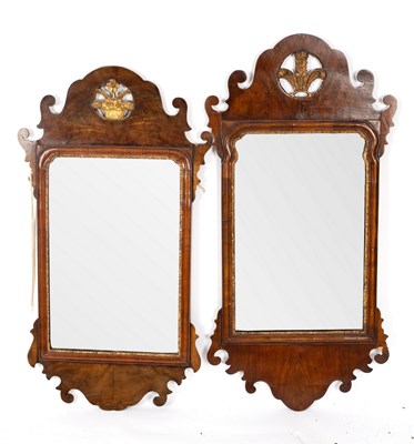 Lot 689 - Two Georgian walnut fret carved wall mirrors,...