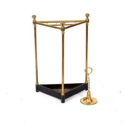 Lot 692 - A brass corner stick stand, with cast iron...