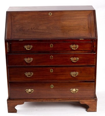 Lot 702 - A George III mahogany bureau, handles replaced,...