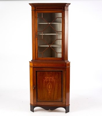 Lot 706 - An Edwardian mahogany floor standing corner...