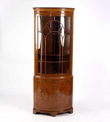 Lot 708 - A walnut and burr walnut bowfront floor...