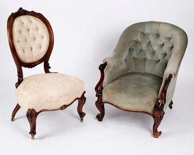 Lot 715 - A Victorian button back tub armchair on carved...