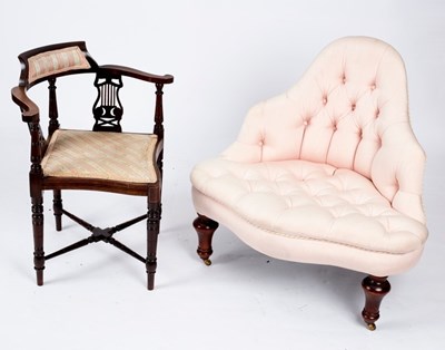 Lot 717 - A button upholstered corner armchair on turned...