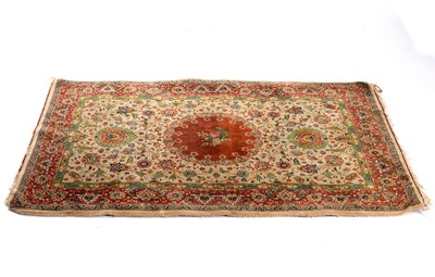 Lot 751 - A Kashan rug with floral design on a camel...