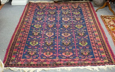 Lot 759 - An Eastern rug decorated stylised designs on a...