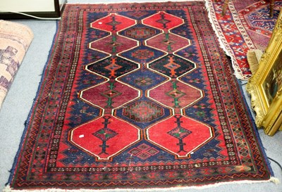 Lot 760 - An Eastern rug decorated triple pole...