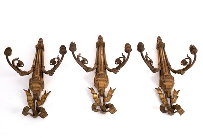 Lot 780 - Three two-branch gilt metal wall lights,...