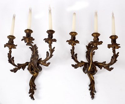 Lot 792 - A pair of Louis XV style ormolu three-branch...