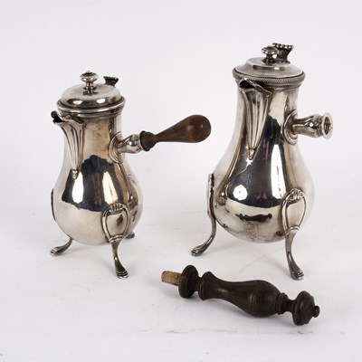 Lot 106 - A near pair of French silver coffee pots, one...