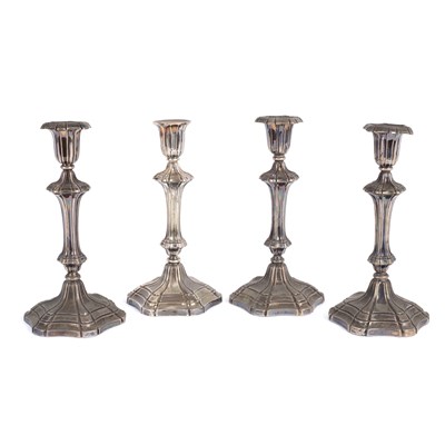 Lot 170 - A set of four William IV silver candlesticks,...