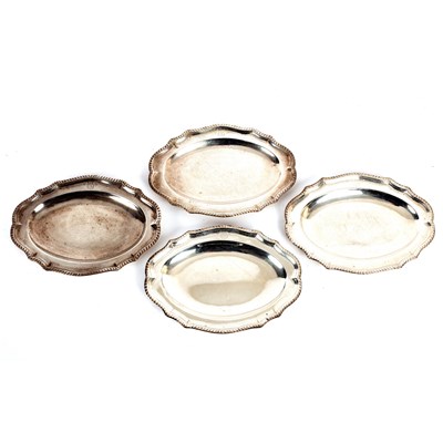 Lot 176 - A set of four George III silver meat dishes,...