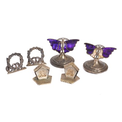 Lot 255 - Three Edwardian silver menu holders, London...