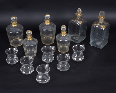 Lot 424 - A set of four decanters and stoppers with gilt...