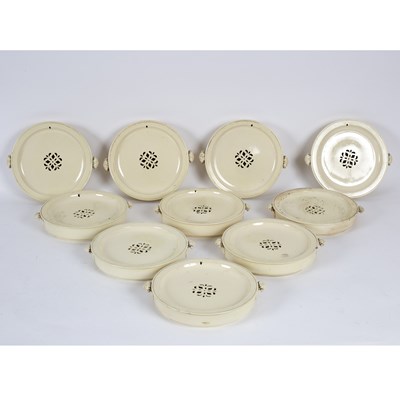 Lot 469 - A set of ten English creamware warming dishes,...