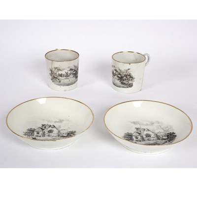 Lot 470 - Two English porcelain printed cans and saucers,...