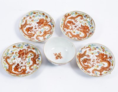 Lot 489 - Four Chinese saucers decorated with iron red...