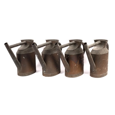 Lot 581 - Four copper watering cans, 42cm high/see...