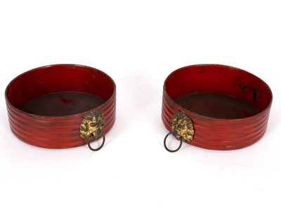 Lot 587 - A pair of Regency red japanned reeded...