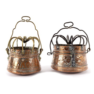 Lot 594 - Two Charles I embossed copper hanging braziers,...