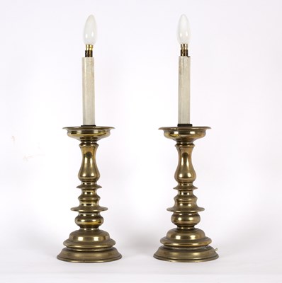 Lot 596 - A pair of European brass pricket candlesticks,...