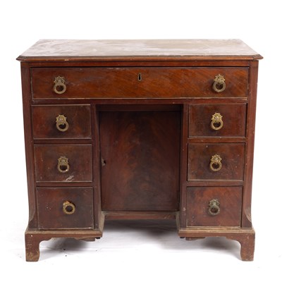 Lot 664 - A George III mahogany kneehole desk fitted...