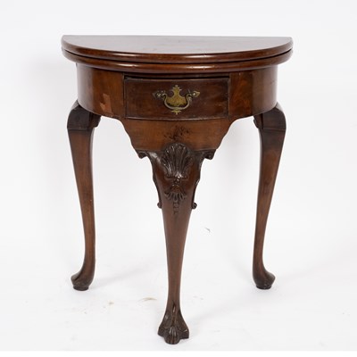 Lot 692 - A walnut semi-circular fold-over top tea table,...