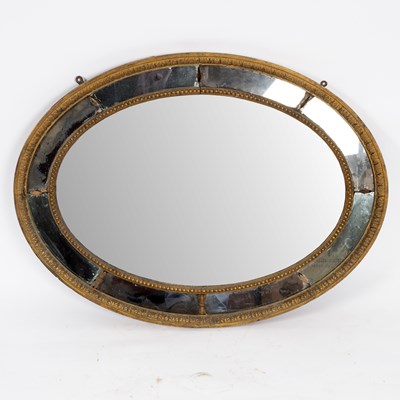 Lot 702 - A George III giltwood mirror, circa 1780, the...