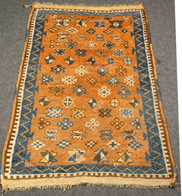 Lot 736 - A Moroccan rug, modern copper red gul field,...