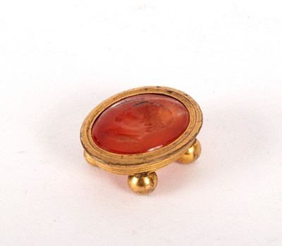 Lot 6 - An intaglio carved oval carnelian, depicting a...