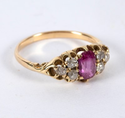 Lot 9 - A ruby and diamond dress ring, the central...